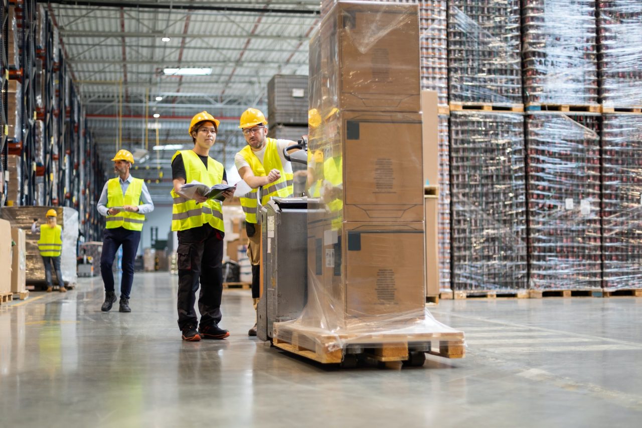 employees-consult-while-working-in-the-warehouse